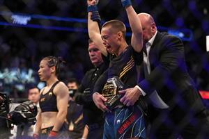 JACKSONVILLE, FL - APRIL 24: Rose Namajunas of the United States celebrates after beating Zhang Weili of China during the Women's Strawweight Title bout of UFC 261 at VyStar Veterans Memorial Arena on April 24, 2021 in Jacksonville, Florida. (Getty Images)