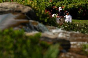 SINGAPORE, SINGAPORE - APRIL 27: Ariya Jutanugarn (R) of Thailand walks with her caddie Peter Bryan Godfrey to the fourth tee during a practice day prior to the HSBC Women's World Championship at Sentosa Golf Club on April 27, 2021 in Singapore. (Getty Images)
