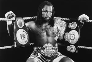 2000: Portrait of Undisputed World Heavyweight Champion, Lennox Lewis, with his championship belts (Getty Images)