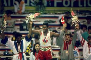 17 Sep-2 Oct 1988: Lennox Lewis of Canada celebrates after receiving the gold medal for the Super Heavyweight bout against Riddick Bowe of the USA during the 1988 Olympics Games at the Olympic Stadium in Seoul, South Korea. (Getty Images)