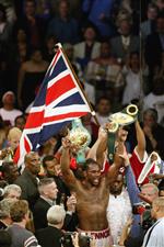 LOS ANGELES - JUNE 21: Lennox Lewis celebrates the victory over Vitali Klitschko in the WBC and IBO World Heavyweight Championship bout at the Staples Center on June 21, 2003 in Los Angeles, California. Lennox Lewis (41-2-1) defeated Vitali Klitschko (32-2) by TKO in the sixth round. (Getty Images)