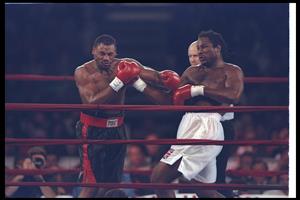 7 Feb 1997: Lennox Lewis and Oliver McCall trade blows during a bout at the Las Vegas Hilton in Las Vegas, Nevada. Lewis won the fight. (Getty Images)
