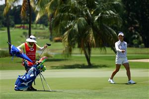 SINGAPORE, SINGAPORE - APRIL 29: Hee Young Park (R) of South Korea reacts with her caddie Prank Dejsubha after sinking her putt on the 16th green during the first round of the HSBC Women's World Championship at Sentosa Golf Club on April 29, 2021 in Singapore. (Getty Images)
