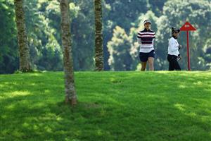 SINGAPORE, SINGAPORE - APRIL 29: Hannah Green of Australia and Patty Tavatanakit of Thailand walk to the ninth tee after putting on the eighth green during the first round of the HSBC Women's World Championship at Sentosa Golf Club on April 29, 2021 in Singapore. (Getty Images)