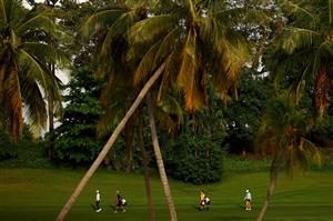 SINGAPORE, SINGAPORE - APRIL 30: Jing Yan (L) of China and Ally Ewing (R) of the United States walk with their caddies on the 12th fairway during the second round of the HSBC Women's World Championship at Sentosa Golf Club on April 30, 2021 in Singapore. (Getty Images)