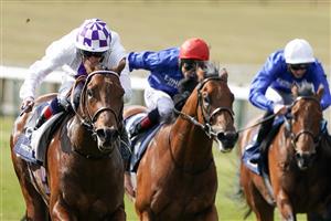 NEWMARKET, ENGLAND - MAY 01: Kevin Manning riding Poetic Flare (L, white) win The Qipco 2000 Guineas Stakes at Newmarket Racecourse on May 01, 2021 in Newmarket, England. Only owners are allowed to attend the meeting but the public must wait until further restrictions are lifted. (Photo by Alan Crowhurst/Getty Images)