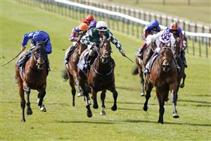 NEWMARKET, ENGLAND - MAY 01: Kevin Manning riding Poetic Flare (R, white) win The Qipco 2000 Guineas Stakes at Newmarket Racecourse on May 01, 2021 in Newmarket, England. Only owners are allowed to attend the meeting but the public must wait until further restrictions are lifted. (Photo by Alan Crowhurst/Getty Images)