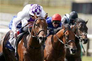 NEWMARKET, ENGLAND - MAY 01: Kevin Manning riding Poetic Flare (L, white) win The Qipco 2000 Guineas Stakes at Newmarket Racecourse on May 01, 2021 in Newmarket, England. Only owners are allowed to attend the meeting but the public must wait until further restrictions are lifted. (Photo by Alan Crowhurst/Getty Images)