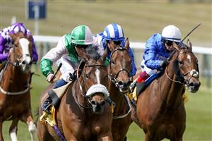 NEWMARKET, ENGLAND - MAY 01: William Carver riding Bell Rock (L, pink/green) win The 'My Oddsboost' On Betfair Suffolk Stakes at Newmarket Racecourse on May 01, 2021 in Newmarket, England. Only owners are allowed to attend the meeting but the public must wait until further restrictions are lifted. (Photo by Alan Crowhurst/Getty Images)