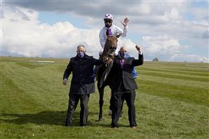 NEWMARKET, ENGLAND - MAY 01: Kevin Manning riding Poetic Flare celebrate after winning The Qipco 2000 Guineas Stakes at Newmarket Racecourse on May 01, 2021 in Newmarket, England. Only owners are allowed to attend the meeting but the public must wait until further restrictions are lifted. (Photo by Alan Crowhurst/Getty Images)