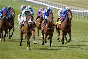 NEWMARKET, ENGLAND - MAY 01: William Carver riding Bell Rock (L, pink/green) win The 'My Oddsboost' On Betfair Suffolk Stakes at Newmarket Racecourse on May 01, 2021 in Newmarket, England. Only owners are allowed to attend the meeting but the public must wait until further restrictions are lifted. (Photo by Alan Crowhurst/Getty Images)