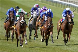 NEWMARKET, ENGLAND - MAY 01: William Carver riding Bell Rock (L, pink/green) win The 'My Oddsboost' On Betfair Suffolk Stakes at Newmarket Racecourse on May 01, 2021 in Newmarket, England. Only owners are allowed to attend the meeting but the public must wait until further restrictions are lifted. (Photo by Alan Crowhurst/Getty Images)