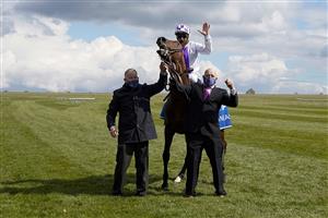 NEWMARKET, ENGLAND - MAY 01: Kevin Manning riding Poetic Flare celebrate after winning The Qipco 2000 Guineas Stakes at Newmarket Racecourse on May 01, 2021 in Newmarket, England. Only owners are allowed to attend the meeting but the public must wait until further restrictions are lifted. (Photo by Alan Crowhurst/Getty Images)