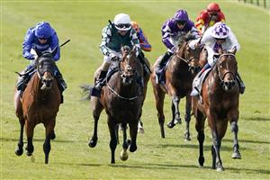 NEWMARKET, ENGLAND - MAY 01: Kevin Manning riding Poetic Flare (R, white) win The Qipco 2000 Guineas Stakes at Newmarket Racecourse on May 01, 2021 in Newmarket, England. Only owners are allowed to attend the meeting but the public must wait until further restrictions are lifted. (Photo by Alan Crowhurst/Getty Images)
