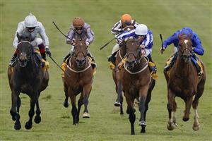 NEWMARKET, ENGLAND - MAY 02: Ben Curtis riding Zabeel Champion (C, white cap) win The Back And Lay On Betfair Exchange Handicap at Newmarket Racecourse on May 02, 2021 in Newmarket, England. Only owners are allowed to attend the meeting but the public must wait until further restrictions are lifted. (Photo by Alan Crowhurst/Getty Images)