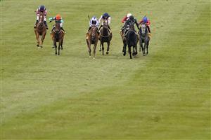 NEWMARKET, ENGLAND - MAY 02: Kieran Shoemark riding Lady Bowthorpe (L, orange cap) win The Betfair Dahlia Stakes at Newmarket Racecourse on May 02, 2021 in Newmarket, England. Only owners are allowed to attend the meeting but the public must wait until further restrictions are lifted. (Photo by Alan Crowhurst/Getty Images)
