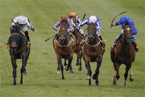 NEWMARKET, ENGLAND - MAY 02: Ben Curtis riding Zabeel Champion (C, white cap) win The Back And Lay On Betfair Exchange Handicap at Newmarket Racecourse on May 02, 2021 in Newmarket, England. Only owners are allowed to attend the meeting but the public must wait until further restrictions are lifted. (Photo by Alan Crowhurst/Getty Images)
