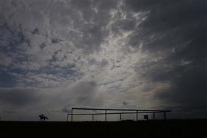 NEWMARKET, ENGLAND - MAY 02: A general view as runners ease down after finishing The at Newmarket Racecourse on May 02, 2021 in Newmarket, England. Only owners are allowed to attend the meeting but the public must wait until further restrictions are lifted. (Photo by Alan Crowhurst/Getty Images)Betfair British EBF Maiden Stakes