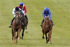 NEWMARKET, ENGLAND - MAY 02: Tom Marquand riding Parachute (L) win The Betfair Weighed In Podcast Handicap at Newmarket Racecourse on May 02, 2021 in Newmarket, England. Only owners are allowed to attend the meeting but the public must wait until further restrictions are lifted. (Photo by Alan Crowhurst/Getty Images)