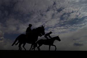 NEWMARKET, ENGLAND - MAY 02: A general view as runners ease down after finishing The at Newmarket Racecourse on May 02, 2021 in Newmarket, England. Only owners are allowed to attend the meeting but the public must wait until further restrictions are lifted. (Photo by Alan Crowhurst/Getty Images)Betfair British EBF Maiden Stakes