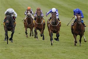 NEWMARKET, ENGLAND - MAY 02: Ben Curtis riding Zabeel Champion (C, white cap) win The Back And Lay On Betfair Exchange Handicap at Newmarket Racecourse on May 02, 2021 in Newmarket, England. Only owners are allowed to attend the meeting but the public must wait until further restrictions are lifted. (Photo by Alan Crowhurst/Getty Images)
