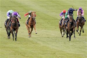 NEWMARKET, ENGLAND - MAY 02: Frankie Dettori riding Mother Earth (L, purple) win The Qipco 1000 Guineas Stakes at Newmarket Racecourse on May 02, 2021 in Newmarket, England. Only owners are allowed to attend the meeting but the public must wait until further restrictions are lifted. (Photo by Alan Crowhurst/Getty Images)