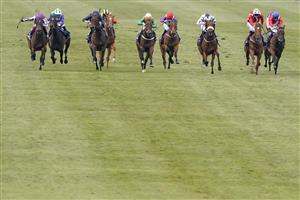 NEWMARKET, ENGLAND - MAY 02: Frankie Dettori riding Mother Earth (L, purple) win The Qipco 1000 Guineas Stakes at Newmarket Racecourse on May 02, 2021 in Newmarket, England. Only owners are allowed to attend the meeting but the public must wait until further restrictions are lifted. (Photo by Alan Crowhurst/Getty Images)