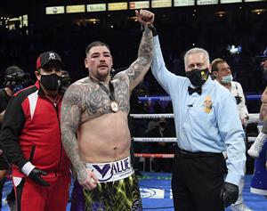 CARSON, CALIFORNIA - MAY 01: Andy Ruiz celebrates his win as he has his hand raised by referee Jack Reiss after a 12 round unanimous decision over Chris Arreola, during a heavyweight bout at Dignity Health Sports Park on May 01, 2021 in Carson, California. (Getty Images)