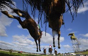 WARRNAMBOOL, AUSTRALIA - MAY 04: Darryl Horner jnr riding Flying Agent (bottom R) races away to defeat Steven Pateman riding Bit of a Lad in Race 6, the 3yb Scotty Stewart Brierly Steeplechase, on Brierly Day during the Warrnambool Jumps Carnival at Warrnambool Racing Club on May 04, 2021 in Warrnambool, Australia. (Photo by Vince Caligiuri/Getty Images)