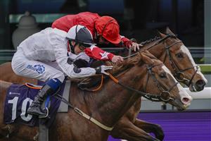 CHESTER, ENGLAND - MAY 06: Connor Beasley riding Baryshnikov (white) win The Destination 2 Handicap from Paul Hanagan and Spirit Dancer (red) at Chester Racecourse on May 06, 2021 in Chester, England. Only owners are allowed to attend the meeting but the public must wait until further restrictions are lifted. (Photo by Alan Crowhurst/Getty Images)