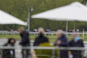 CHESTER, ENGLAND - MAY 06: A general view as runners race down the back straight as owners wait in the home straight for their arrival during The Destination 2 Handicap at Chester Racecourse on May 06, 2021 in Chester, England. Only owners are allowed to attend the meeting but the public must wait until further restrictions are lifted. (Photo by Alan Crowhurst/Getty Images)
