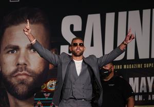 ARLINGTON, TEXAS - MAY 06: Billy Joe Saunders raises his arms against Canelo Alvarez during the press conference for Alvarez's WBC and WBA super middleweight titles and Saunders' WBO super middleweight title at Live! by Loews hotel on May 06, 2021 in Arlington, Texas. (Getty Images)