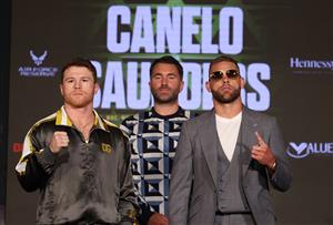 ARLINGTON, TEXAS - MAY 06: Canelo Alvarez and Billy Joe Saunders face off with Matchroom Promoter Eddie Hearn looking on during the press conference for Alvarez's WBC and WBA super middleweight titles and Saunders' WBO super middleweight title at Live! by Loews hotel on May 06, 2021 in Arlington, Texas. (Getty Images)