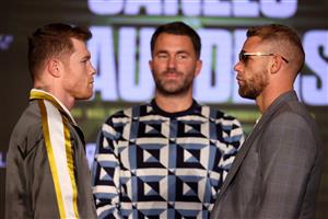 ARLINGTON, TEXAS - MAY 06: Canelo Alvarez and Billy Joe Saunders face off with Matchroom Promoter Eddie Hearn looking on during the press conference for Alvarez's WBC and WBA super middleweight titles and Saunders' WBO super middleweight title at Live! by Loews hotel on May 06, 2021 in Arlington, Texas. (Getty Images)