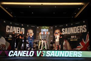 ARLINGTON, TEXAS - MAY 06: Canelo Alvarez and Billy Joe Saunders face off with Matchroom Promoter Eddie Hearn looking on during the press conference for Alvarez's WBC and WBA super middleweight titles and Saunders' WBO super middleweight title at Live! by Loews hotel on May 06, 2021 in Arlington, Texas. (Getty Images)