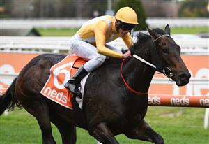 MELBOURNE, AUSTRALIA - MAY 08: Lachlan Neindorf riding Running Cloud winning Race 8, the Rod Fenwick Handicap, during Melbourne Racing at Caulfield Racecourse on May 08, 2021 in Melbourne, Australia. (Photo by Vince Caligiuri/Getty Images)