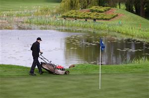 SUTTON COLDFIELD, ENGLAND - MAY 11: A greenkeeper cuts the lawn as they prepare the course during previews ahead of The Betfred British Masters hosted by Danny Willett at The Belfry on May 11, 2021 in Sutton Coldfield, England. (Getty Images)