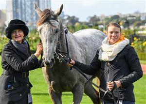 MELBOURNE, AUSTRALIA - MAY 15: Wendy Kelly poses with Cakewalk Baby after winning Race 2, the Goodwood Trophy, during Melbourne Racing at Flemington Racecourse on May 15, 2021 in Melbourne, Australia. (Photo by Vince Caligiuri/Getty Images)