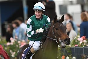 MELBOURNE, AUSTRALIA - MAY 15: Mark Zahra riding Yulong January after winning Race 8, the Congratulations Arhof Inductees, during Melbourne Racing at Flemington Racecourse on May 15, 2021 in Melbourne, Australia. (Photo by Vince Caligiuri/Getty Images)