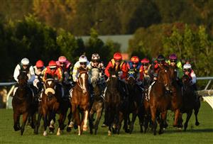 MELBOURNE, AUSTRALIA - MAY 15: Mark Zahra riding Vegas Knight (red cap) on the home turn before winning Race 9, the York Trophy, during Melbourne Racing at Flemington Racecourse on May 15, 2021 in Melbourne, Australia. (Photo by Vince Caligiuri/Getty Images)
