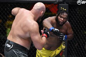 LAS VEGAS, NEVADA - MAY 22: In this handout images provided by UFC, (R-L) Chris Barnett punches Ben Rothwell in their heavyweight bout during the UFC Fight Night event at UFC APEX on May 22, 2021 in Las Vegas, Nevada. (Getty Images)