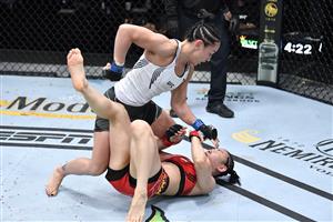 LAS VEGAS, NEVADA - MAY 22: In this handout image provided by UFC, (L-R) Carla Esparza punches Yan Xiaonan of China in their women's strawweight bout during the UFC Fight Night event at UFC APEX on May 22, 2021 in Las Vegas, Nevada. (Getty Images)