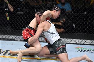 LAS VEGAS, NEVADA - MAY 22: In this handout image provided by UFC, (L-R) Yan Xiaonan of China and Carla Esparza engage in their women's strawweight bout during the UFC Fight Night event at UFC APEX on May 22, 2021 in Las Vegas, Nevada. (Getty Images)