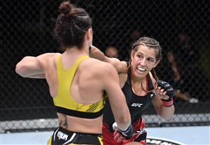 LAS VEGAS, NEVADA - MAY 22: In this handout image provided by UFC, (R-L) Felicia Spencer of Canada punches Norma Dumont Viana of Brazil in their women's featherweight bout during the UFC Fight Night event at UFC APEX on May 22, 2021 in Las Vegas, Nevada. (Getty Images)