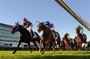 MELBOURNE, AUSTRALIA - MAY 22: Jamie Kah riding Horrifying defeats Craig Newitt riding Reuber in Race 7, the Off The Track Community Trophy ,during Melbourne Racing at Flemington Racecourse on May 22, 2021 in Melbourne, Australia. (Photo by Vince Caligiuri/Getty Images)