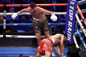 LAS VEGAS, NEVADA - MAY 22: Josh Taylor avoids Jose Ramirez as he falls to the mat after being knocked down during their junior welterweight world unification title fight at Virgin Hotels Las Vegas on May 22, 2021 in Las Vegas, Nevada. Taylor won by unanimous decision. (Getty Images)
