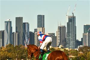 MELBOURNE, AUSTRALIA - MAY 22: Michael Dee riding All Of Brighton heading to the start before winning race 6, the Ecycle Solutions Trophy, during Melbourne Racing at Flemington Racecourse on May 22, 2021 in Melbourne, Australia. (Photo by Vince Caligiuri/Getty Images)