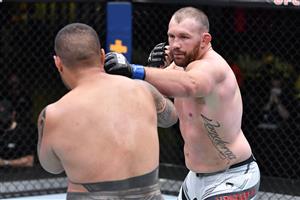 LAS VEGAS, NEVADA - MAY 22: In this handout image provided by UFC, (R-L) Jared Vanderaa punches Justin Tafa of New Zealand in their heavyweight bout during the UFC Fight Night event at UFC APEX on May 22, 2021 in Las Vegas, Nevada. (Getty Images)