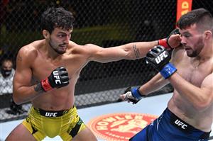 LAS VEGAS, NEVADA - MAY 22: In this handout image provided by UFC, (L-R) Ricardo Ramos of Brazil punches Bill Algeo in their featherweight bout during the UFC Fight Night event at UFC APEX on May 22, 2021 in Las Vegas, Nevada. (Getty Images)