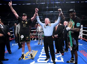 LOS ANGELES, CA - DECEMBER 01: Tyson Fury and Deontay Wilder pose for a photo with referee Jack Reiss after fighting to a draw during the WBC Heavyweight Championship at Staples Center on December 1, 2018 in Los Angeles, California. (Getty Images)
